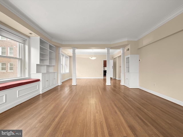 unfurnished living room featuring wood-type flooring, ornate columns, plenty of natural light, and crown molding