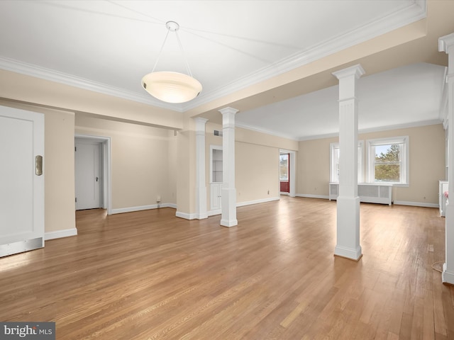 unfurnished living room with crown molding, light wood-style flooring, decorative columns, and baseboards