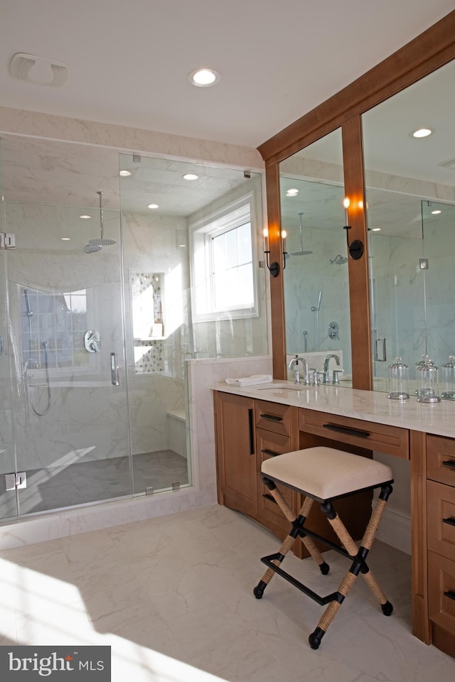 bathroom with vanity and an enclosed shower