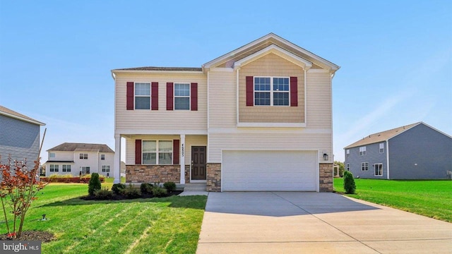 view of front of house with a garage and a front lawn