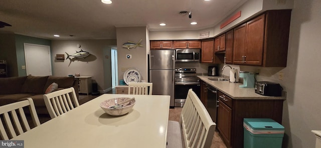 kitchen with sink and appliances with stainless steel finishes