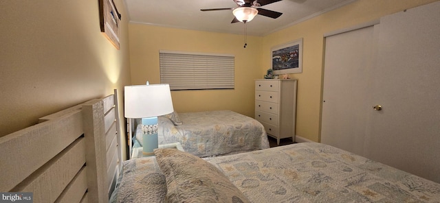 bedroom featuring crown molding and ceiling fan