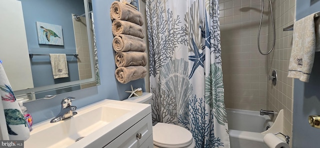 full bathroom with vanity, shower / tub combo, and toilet