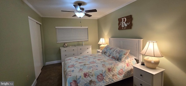 carpeted bedroom with ornamental molding and ceiling fan