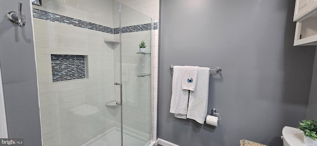 bathroom with toilet and walk in shower