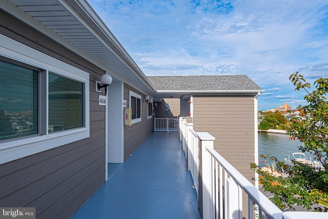 balcony featuring a water view