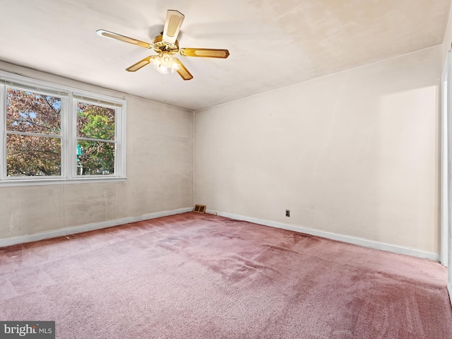 unfurnished room with light carpet and ceiling fan