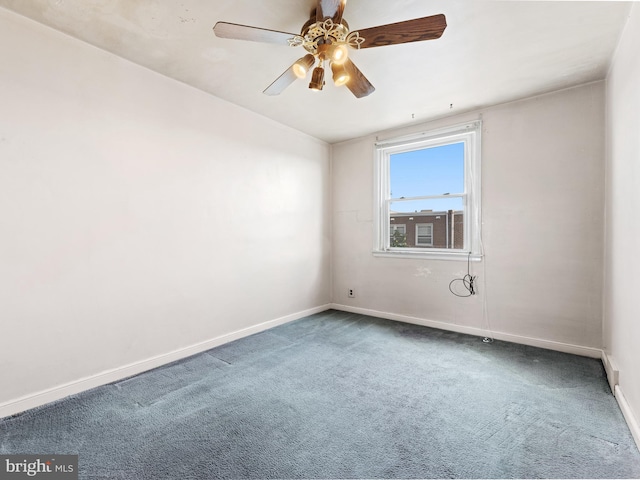 carpeted empty room featuring ceiling fan