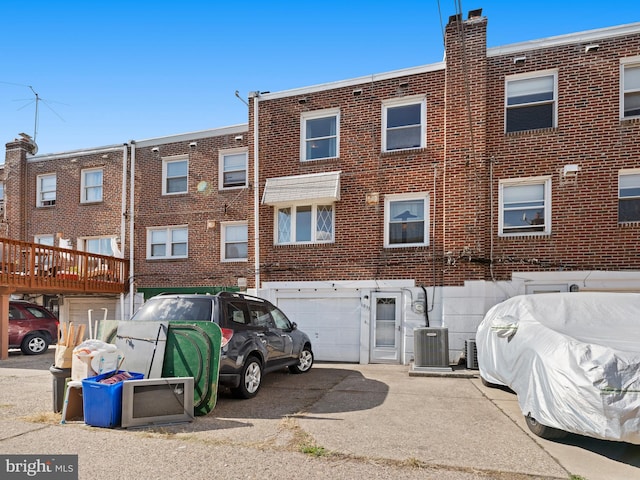 back of property featuring central air condition unit