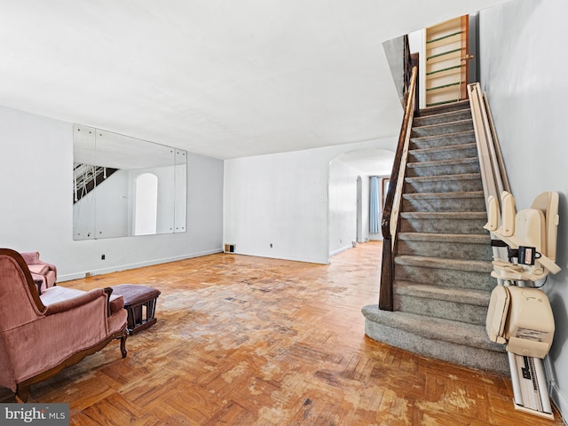 living area with parquet flooring