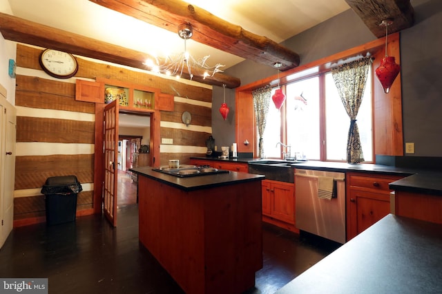 kitchen featuring pendant lighting, sink, an inviting chandelier, appliances with stainless steel finishes, and dark hardwood / wood-style flooring