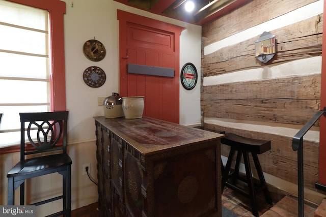 bar featuring wood walls