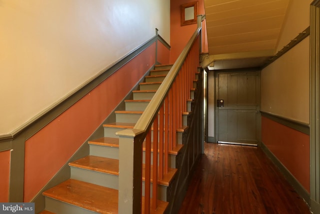 stairs with hardwood / wood-style flooring