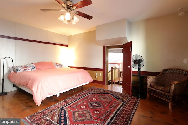 bedroom featuring dark hardwood / wood-style floors and ceiling fan