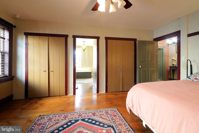 bedroom featuring ceiling fan, connected bathroom, and wood-type flooring