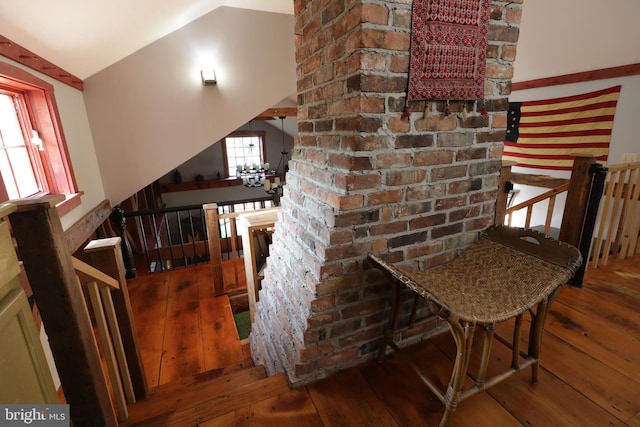 interior space featuring vaulted ceiling and hardwood / wood-style floors