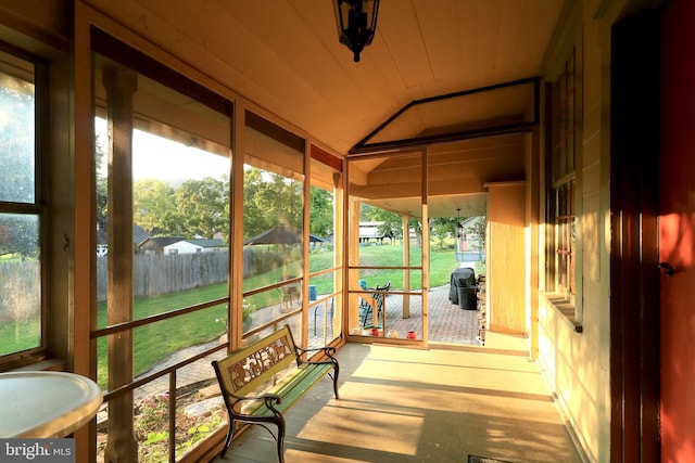 sunroom with lofted ceiling and plenty of natural light