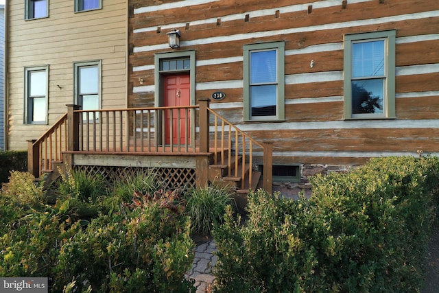 doorway to property featuring a deck