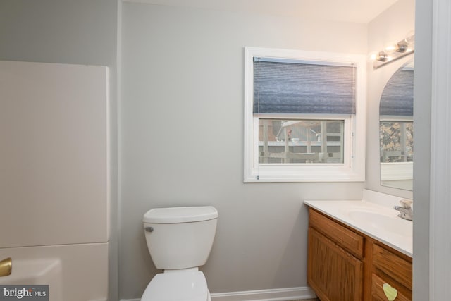 bathroom featuring vanity and toilet