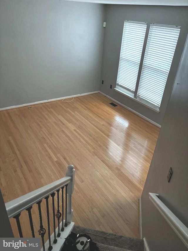 staircase featuring hardwood / wood-style flooring