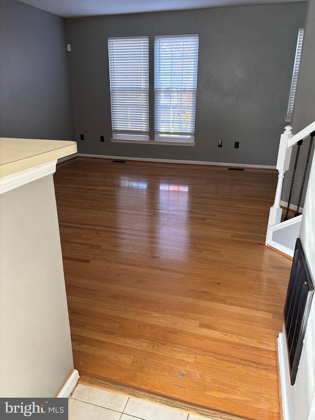 unfurnished living room featuring light hardwood / wood-style flooring