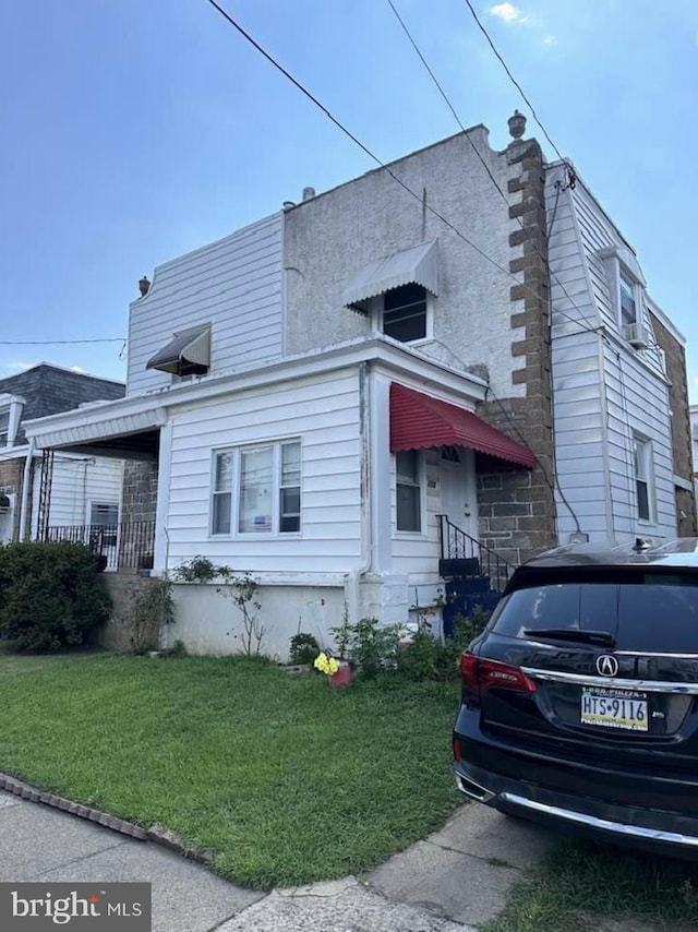 view of front of house with a front yard