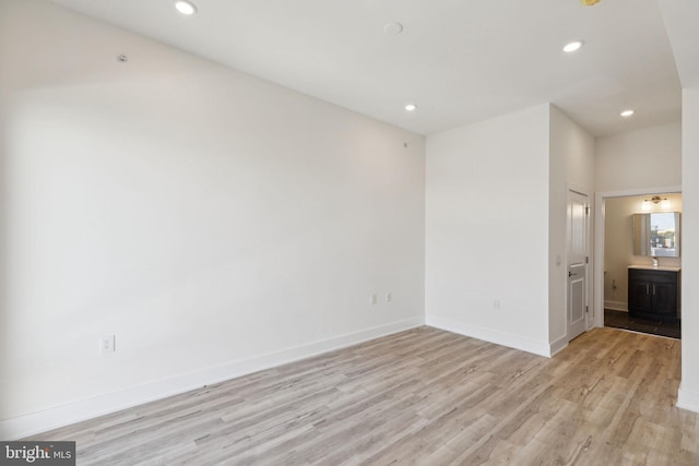 spare room with light hardwood / wood-style floors