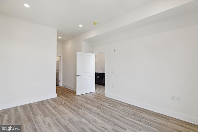 unfurnished room with light hardwood / wood-style floors