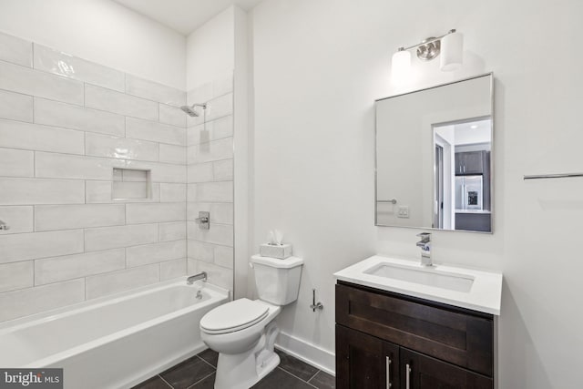 full bathroom with tiled shower / bath, vanity, toilet, and tile patterned floors