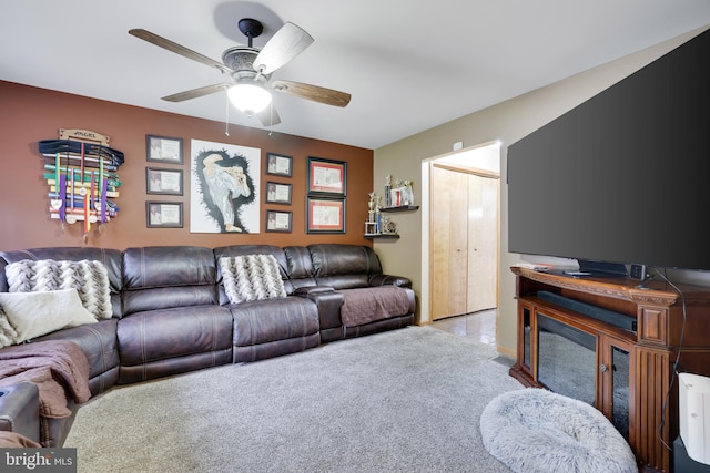 carpeted living room featuring ceiling fan