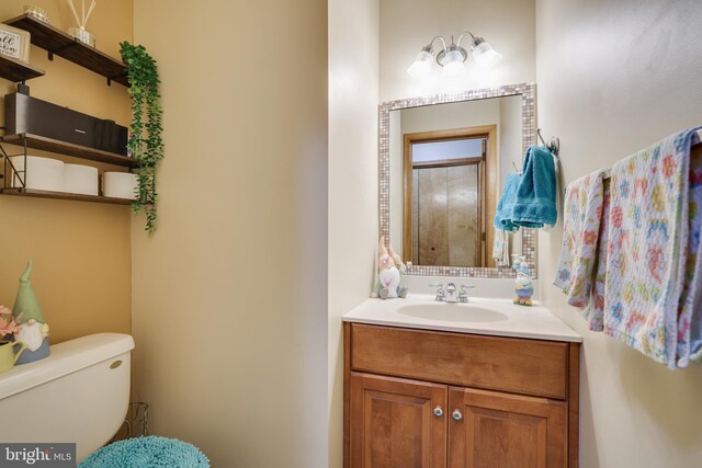 bathroom with vanity and toilet