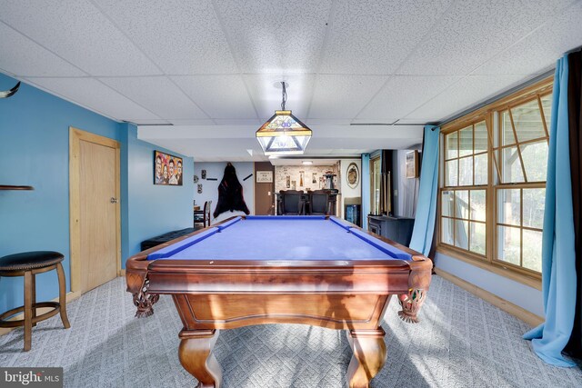 recreation room featuring a drop ceiling, billiards, and light carpet