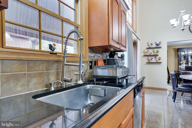 kitchen featuring decorative backsplash, sink, and plenty of natural light