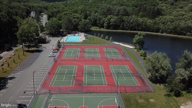 birds eye view of property with a water view