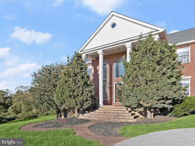 neoclassical / greek revival house with brick siding