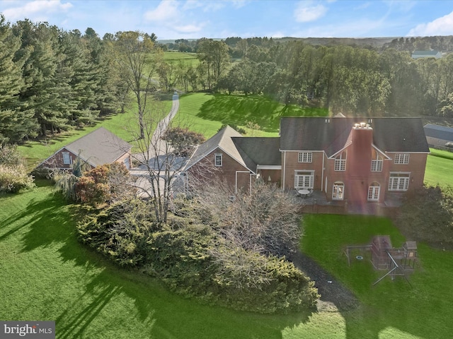 aerial view featuring a view of trees