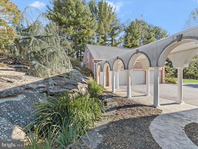 exterior space with concrete driveway