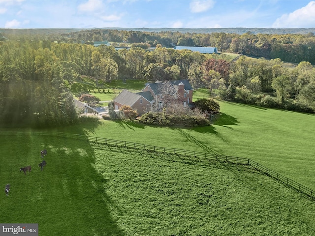 aerial view with a rural view and a view of trees