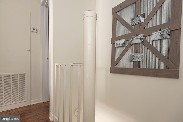 details featuring wood finished floors, visible vents, and baseboards