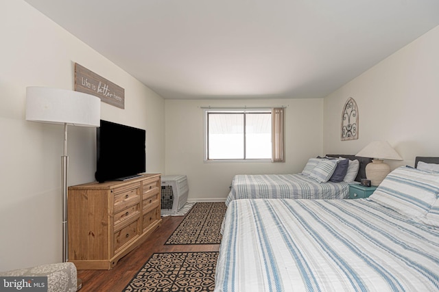 bedroom featuring dark hardwood / wood-style floors