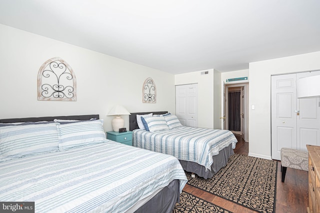 bedroom featuring dark hardwood / wood-style flooring