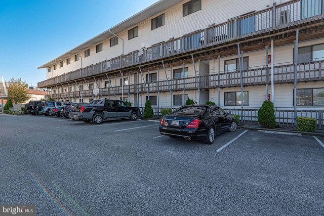 view of building exterior featuring uncovered parking