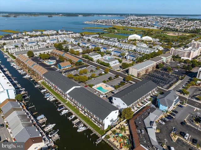 birds eye view of property with a water view