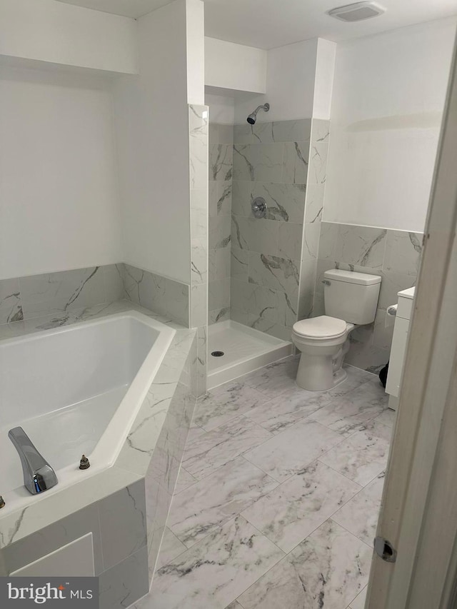 bathroom with plus walk in shower, tile walls, and toilet