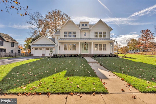 view of front facade with a garage and a front lawn