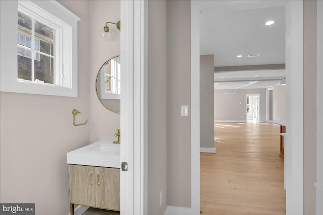 bathroom featuring vanity and wood-type flooring