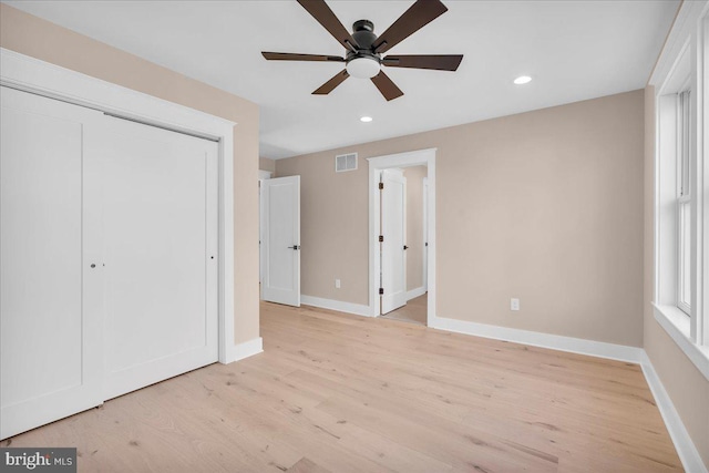 unfurnished bedroom with a closet, ceiling fan, and light hardwood / wood-style flooring