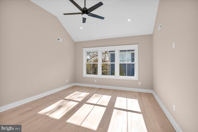 spare room with ceiling fan, light hardwood / wood-style flooring, and vaulted ceiling