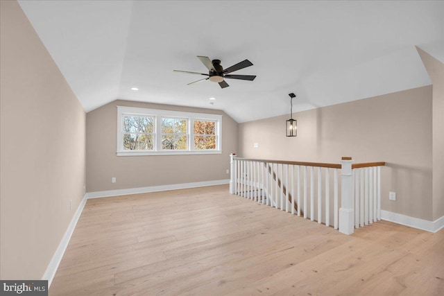 bonus room featuring lofted ceiling, ceiling fan, and light wood-type flooring