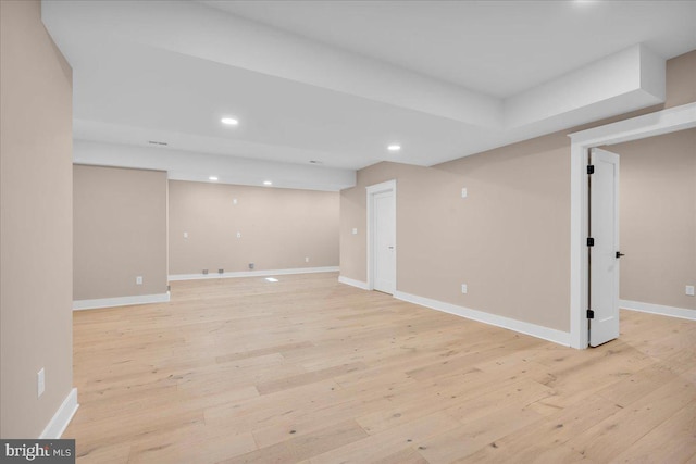 basement featuring light hardwood / wood-style floors